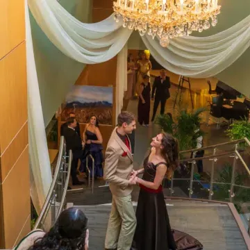 Couple on grand staircase at Viennese Ball